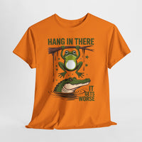 Orange t-shirt with a graphic of a frog and alligator and text 'Hang in there, it gets worse' on a white background.