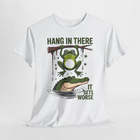 White t-shirt with a graphic of a frog and alligator and text 'Hang in there, it gets worse' on a white background.