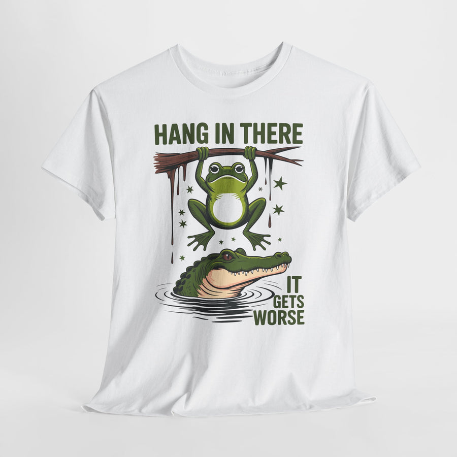 White t-shirt with a graphic of a frog and alligator and text 'Hang in there, it gets worse' on a white background.